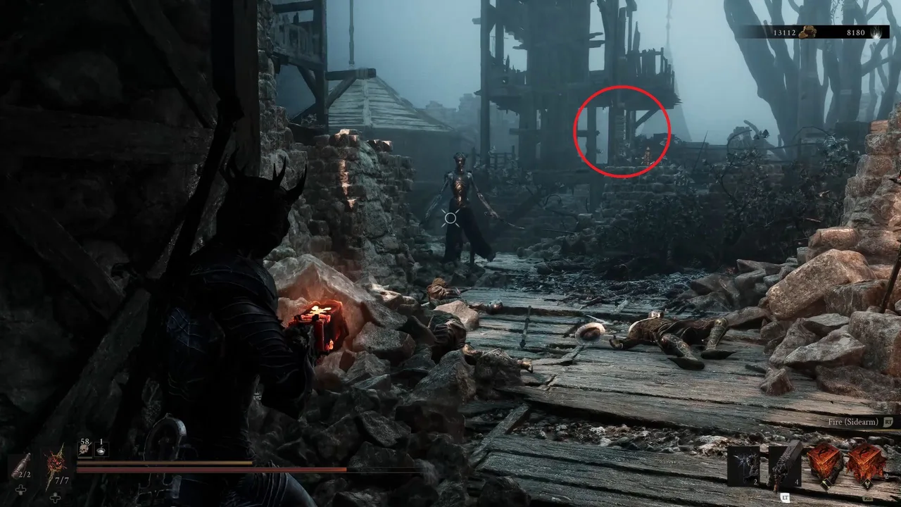 Image showing a Mortal Shell 2 player facing off a Dual Blade Assassin with a red circle highlighting the glistening chain to release the drawbridge