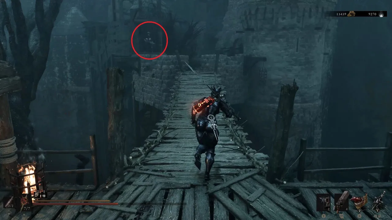 Image showing a Mortal Shell 2 player crossing a chasm on a wooden bridge, with a red circle pointing at the location of a Tophat Sester shooting at them