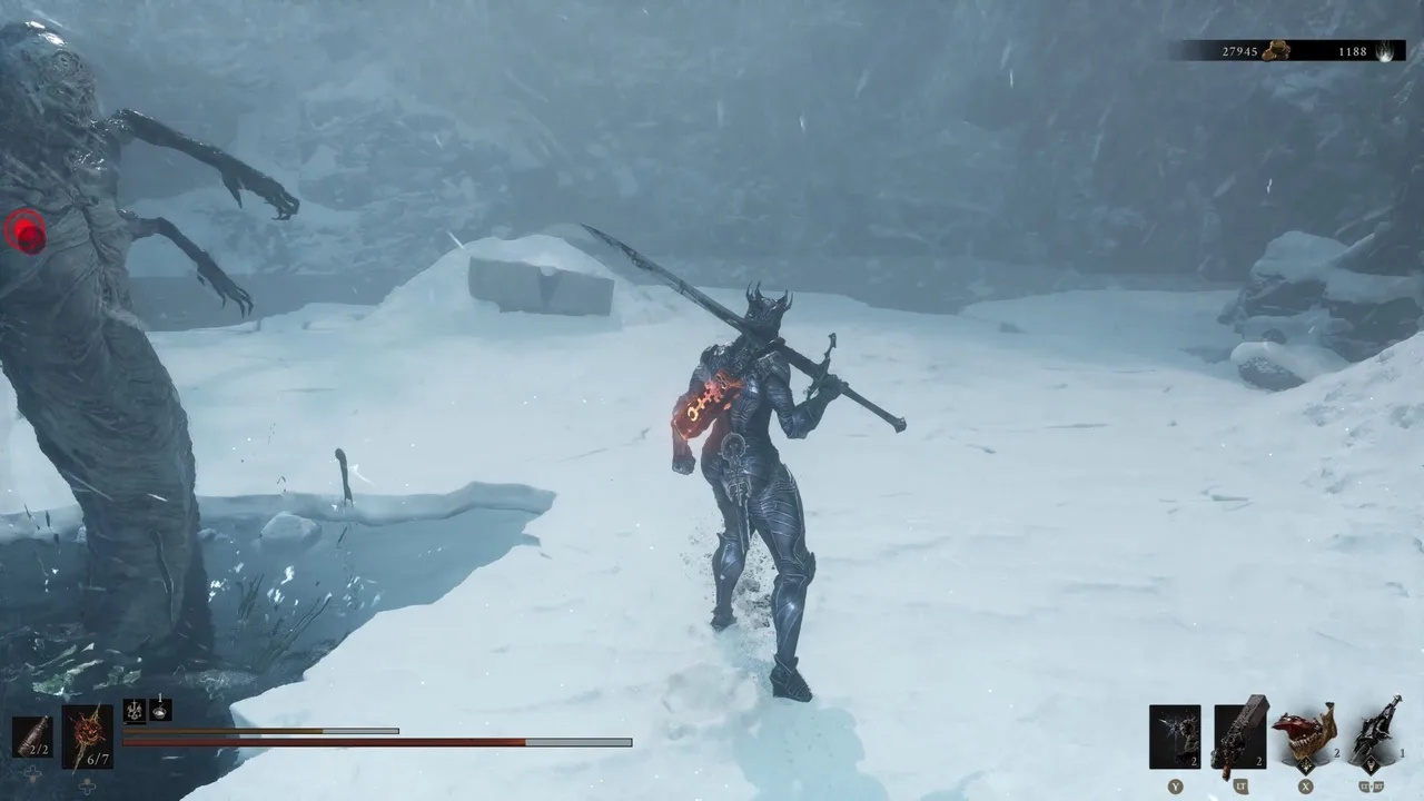 Image showing a Mortal Shell 2 player being attacked by a Snow Stalker while looking at a Stone Slab at the left end of the Winterglass lake