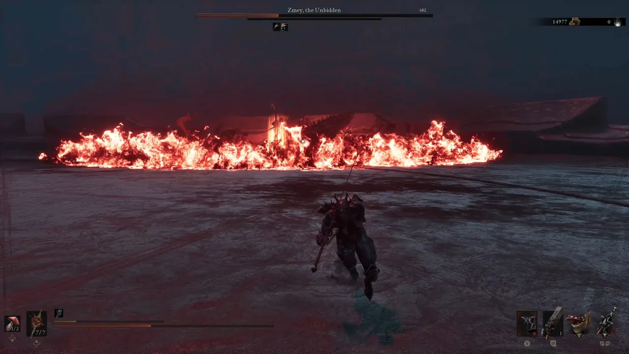 Image showing a Mortal Shell 2 player fighting Zmey, the Unbidden while the Fire Wave attack is happening